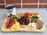 Fortune Favors The Classic Featured on Charcuterie board with meats, cheeses, pickles and veggies