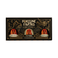 Black and gold sampler gift pack containing three 4 ounce cans of Fortune Favors candied pecans, one of each signature flavor.