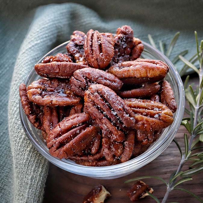 New Communities Fortune Favors candied pecans in a dish